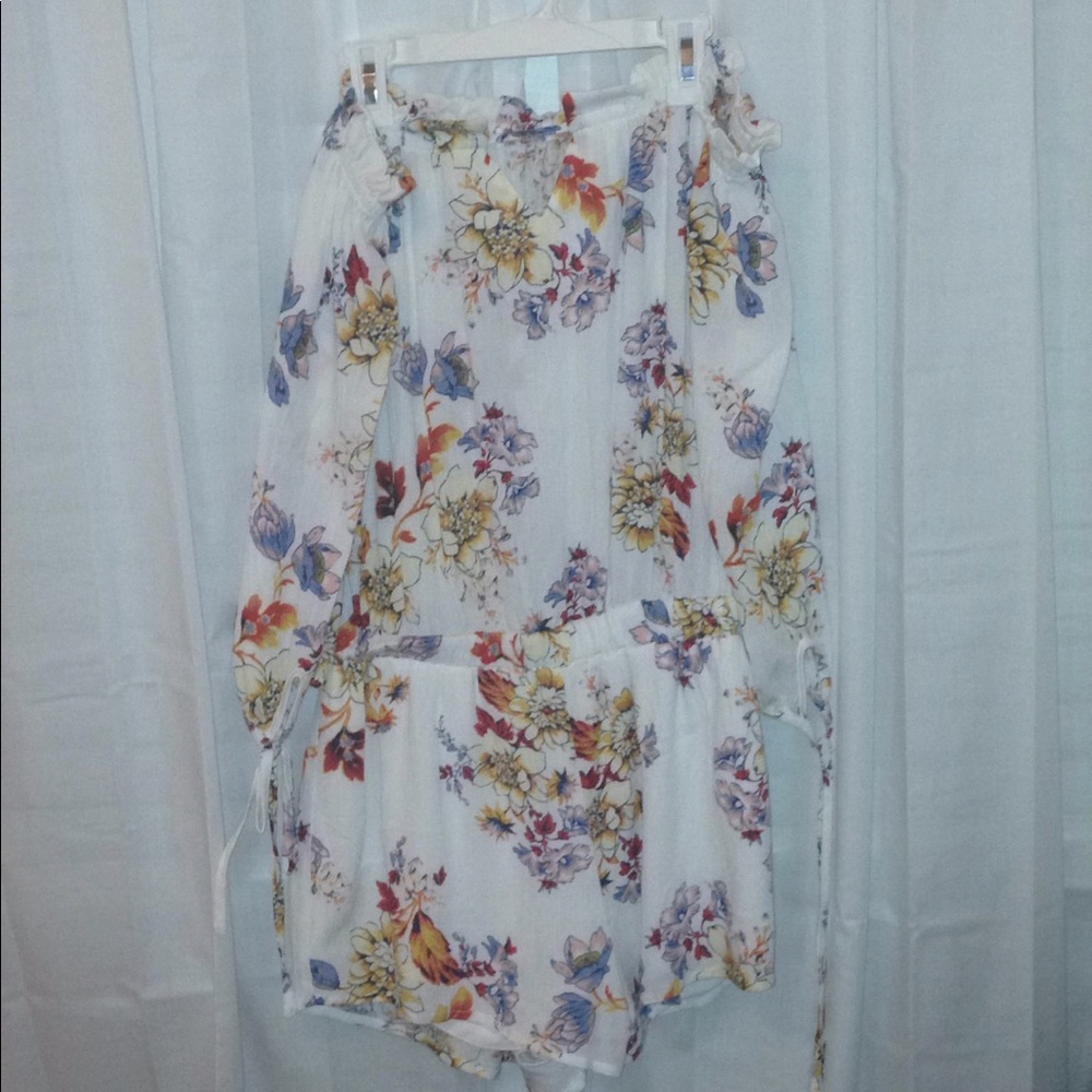 Floral white romper and off the shoulder.